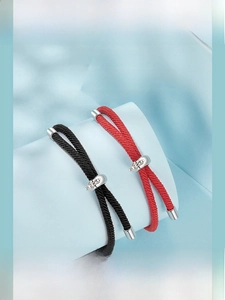 Detail of adjustable woven cord bracelets with polished S925 sterling silver closures