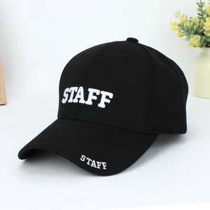 Close-up of STAFF white embroidery on black cotton-blend curved brim baseball cap