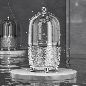 Rotating clear cosmetic organizer with water ripple texture and silver spherical feet