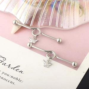 Detail of silver industrial barbell with twisted ring and CZ butterfly pendant