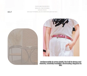 Close-up of a pink faux leather belt for women with a round silver buckle on white pants