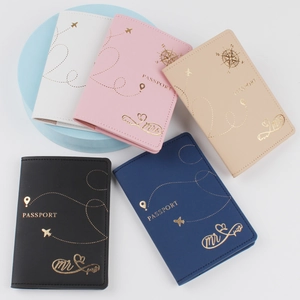 Top view of PU leather passport covers in five colors with gold embossed airplane design