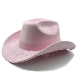 Detail of pink faux suede cowboy hat featuring a classic ribbon trim and curved brim