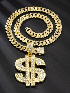 Macro detail of a gold Cuban chain necklace with a sparkling diamond encrusted dollar sign pendant