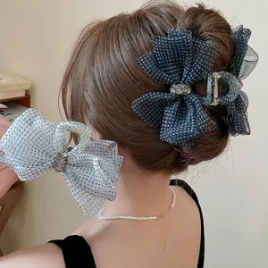 Elegant polka dot mesh bow hair claw clip with rhinestones for high-end styling