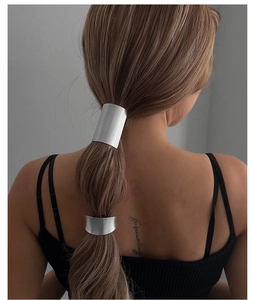 Close-up of model wearing two irregular silver alloy hair rings for ponytail styling