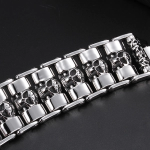 Close-up of punk style skull link bracelet in polished silver stainless steel