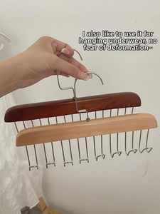 Detail of solid wood multi-hook hanger with 12 stainless steel hooks for camisoles