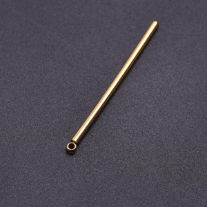 Detailed view of polished gold stainless steel bar pendant with attachment loop