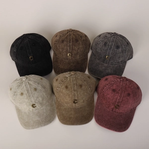 Detailed shot of vintage washed cotton baseball caps in six colors with metal C logo