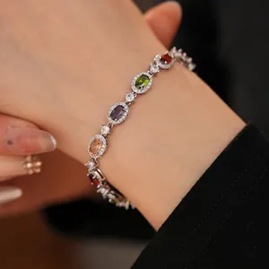 Elegant silver bracelet featuring colorful oval zircons and micro-paved diamond accents