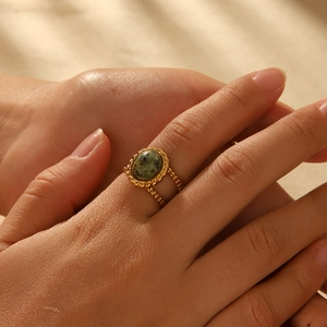 Vintage gold-plated double-band ring featuring an oval green natural stone setting
