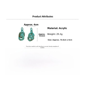 Detail of teal marble acrylic drop earrings with dimensions 10.8cm and 925 silver needles