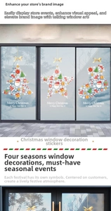 Close-up of colorful Christmas window stickers with Santa Claus and festive tree designs