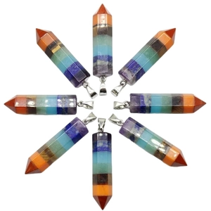 Seven Chakra hexagonal crystal stone pendants arranged in a circular pattern on white background