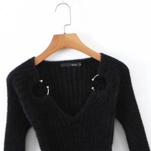 Black V-neck fuzzy knit sweater featuring silver metallic ring accents on wooden hanger