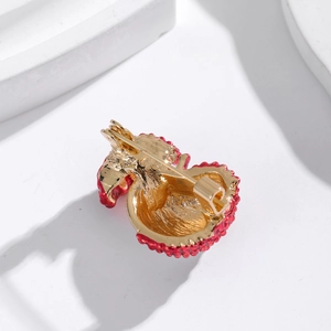 Exquisite red lychee fruit brooch with textured red skin and gold pin back design