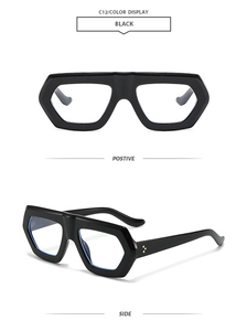 Detailansicht der glänzend schwarzen geometrischen Sonnenbrille mit goldenen Nieten