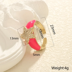 Detailed view of fuchsia enamel star ring with dimensions 13mm and 18mm inner diameter