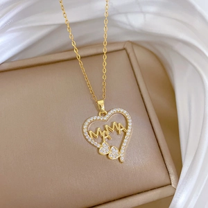Elegant gold titanium heart necklace with MAMA lettering and sparkling zircons