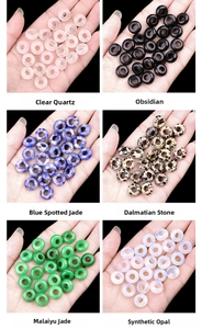 Detailed macro view of mixed natural stone rondelle beads for jewelry making