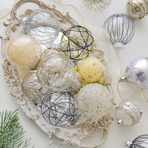 Mixed 8cm Christmas tree ornaments set with matte gold and silver balls on a tray