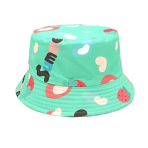 Close-up of mint green cotton bucket hat with strawberry print and summer embroidery
