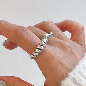 Minimalist 925 sterling silver knot ring with a unique spiral twist and irregular fluid design