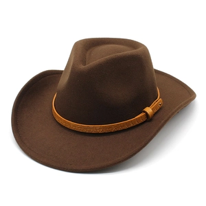 Detail of dark brown wool felt cowboy hat featuring a faux crocodile leather band and metal buckle