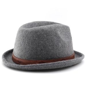 Detail of dark grey wool felt fedora featuring a classic brown leather printed hatband