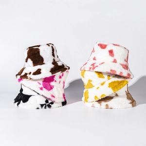 Plush cow print bucket hat set in multiple colors with soft faux fur texture