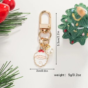 Cartoon Santa Claus keychain with gold finish, pearl accent and precise dimensions