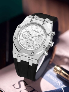Macro view of men's chronograph watch with silver octagonal bezel and black strap