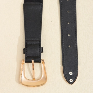 Close-up of black elastic waist belt featuring gold floral buckle and metal tips