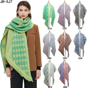Thick jacquard dot scarf in bouclé yarn with 8 color options shown on a model