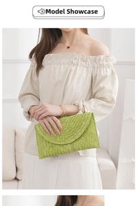 Straw woven clutch bag in vibrant green with semi-circular flap for summer travel style