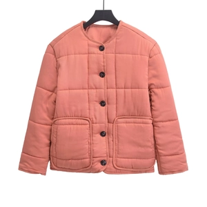 Coral pink quilted short jacket with a round neck and front buttons on a white background