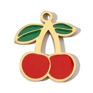 Detailed macro view of cherry charm with red enamel, green leaves and gold plated edges