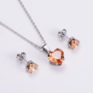 Detail of champagne heart zircon pendant necklace and stud earrings jewelry set