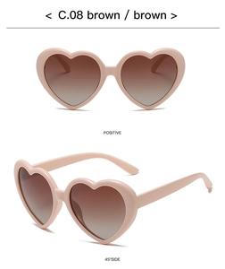 Detail of pink heart-shaped polarized sunglasses with brown gradient lenses and model code