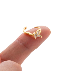 Gold butterfly cartilage hoop earring with sparkling cubic zirconia on white background