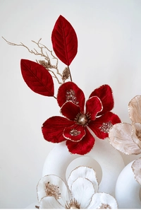 Close-up of luxury velvet magnolia flower with gold glitter details for Christmas decor