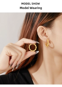 Macro view of vintage brushed gold earrings with shimmering cubic zirconia stones