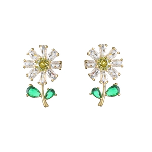 Macro shot of sunflower earrings with yellow and white crystals and green leaf details