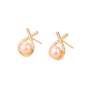 Crossed gold earrings with pink freshwater pearls and white zircon stones on white background