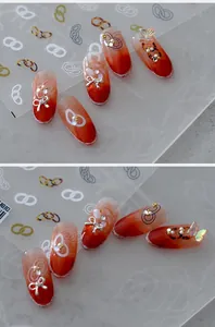 Macro shot of interlocking ring nail stickers and 3D charms on artistic gradient base