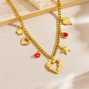 Gold plated stainless steel necklace with heart, star and red teardrop charms on stone