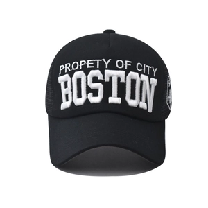 Detail of Boston embroidery on black washed cotton trucker hat with breathable mesh
