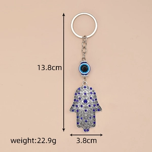 Detail view of Hamsa Hand keychain showing dimensions 13.8cm length and 22.9g weight