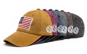Detail view of cotton baseball caps with USA flag embroidery in multiple retro colors